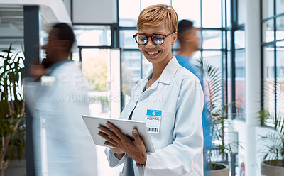 Buy stock photo Doctor, tablet and black woman in busy hospital or clinic for research, telehealth or online consultation. Healthcare app, technology and smile of happy senior medical professional with touchscreen.