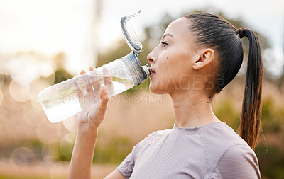 Buy stock photo Fitness, health and woman drinking water in nature after exercise, training or workout. Sports, nutrition bottle and female athlete drink liquid for hydration after exercising, jog or cardio outdoors