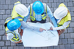 Blueprint, pointing and engineering with people on construction site from top view for planning, building and architecture. Meeting, floor plan and project with group of engineer for idea and graphic