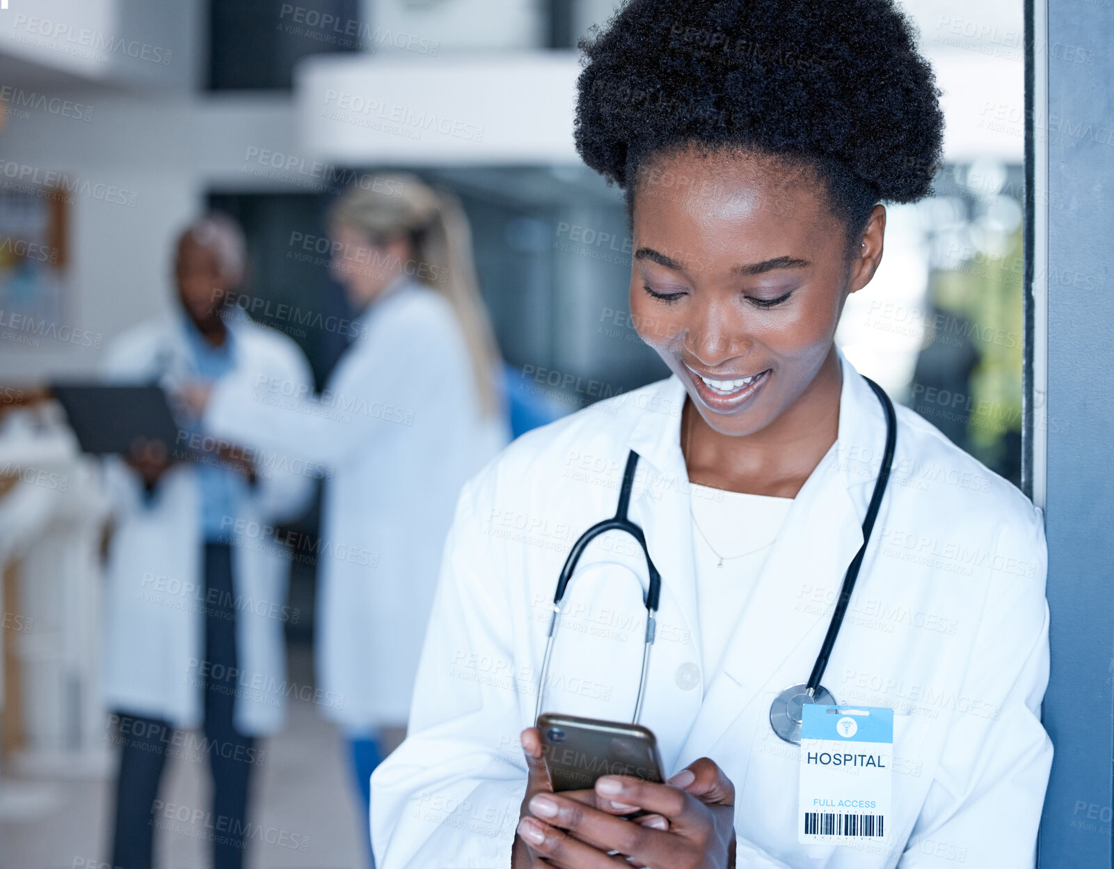 Buy stock photo Black woman, doctor and smile with phone in hospital on telehealth app, internet search and connection. Happy medical worker typing on smartphone technology for contact, reading online chat or clinic