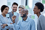 Business, team and black man writing on sticky note, brainstorming and planning for project, smile and collaboration. Corporate, Nigerian male leader or staff share ideas, advertising agency or sales