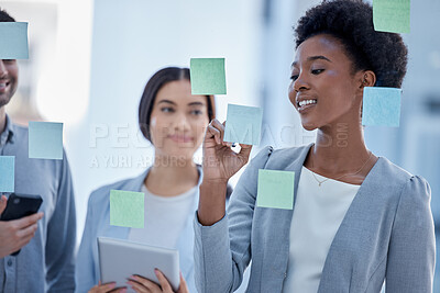 Buy stock photo Black woman, writing and planning schedule with team on glass board for brainstorming meeting at office. Happy African American female in teamwork collaboration, tasks or sticky note for project plan