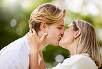 Park, love and couple kiss for romance, quality time and bonding for engagement, vacation and holiday together. Dating, happy and young man and woman hugging, kissing and romantic embrace in nature