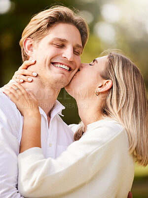 Buy stock photo Park, love and couple kiss for romance, quality time and bonding on weekend, vacation and holiday together. Dating, engagement and young man and woman hugging, kissing and romantic embrace in nature