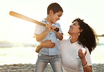 Beach, baseball and a black family with children playing sports together by the ocean or sea at sunset. Kids, love or sport with a mother and son on the sand to play a game while bonding in summer