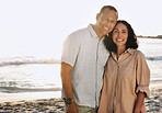 Senior couple, smile and portrait at beach, having fun on vacation or holiday outdoors. Romance, love or happy, elderly and retired man and woman by ocean or seashore enjoying time together at sunset