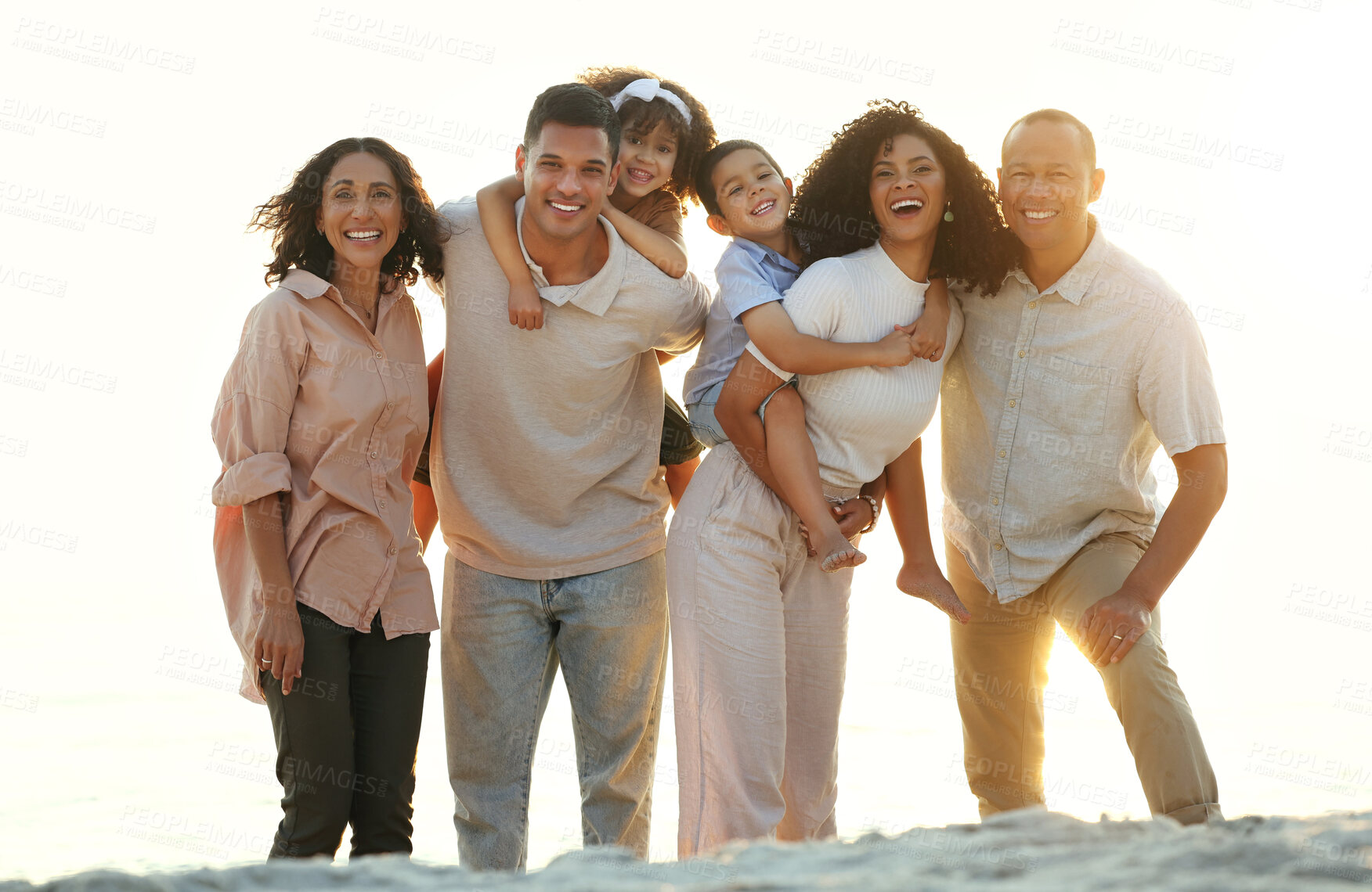 Buy stock photo Big family, sunset and portrait smile at beach, having fun and smiling on vacation outdoors. Care, bonding and happy kids, grandmother and grandfather with parents laughing and enjoying holiday time.