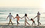 Big family, walking and holding hands at beach at sunset, having fun and bonding on vacation outdoors. Care,  mockup and kids, grandmother and grandfather with mother and father enjoying holiday time