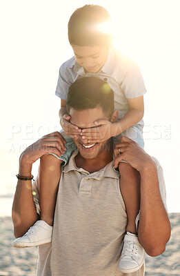 Buy stock photo Beach, travel and child on shoulder of father with hands cover eyes for surprise game, quality time and playing. Family, love and happy boy with dad by ocean bond on adventure, holiday and vacation