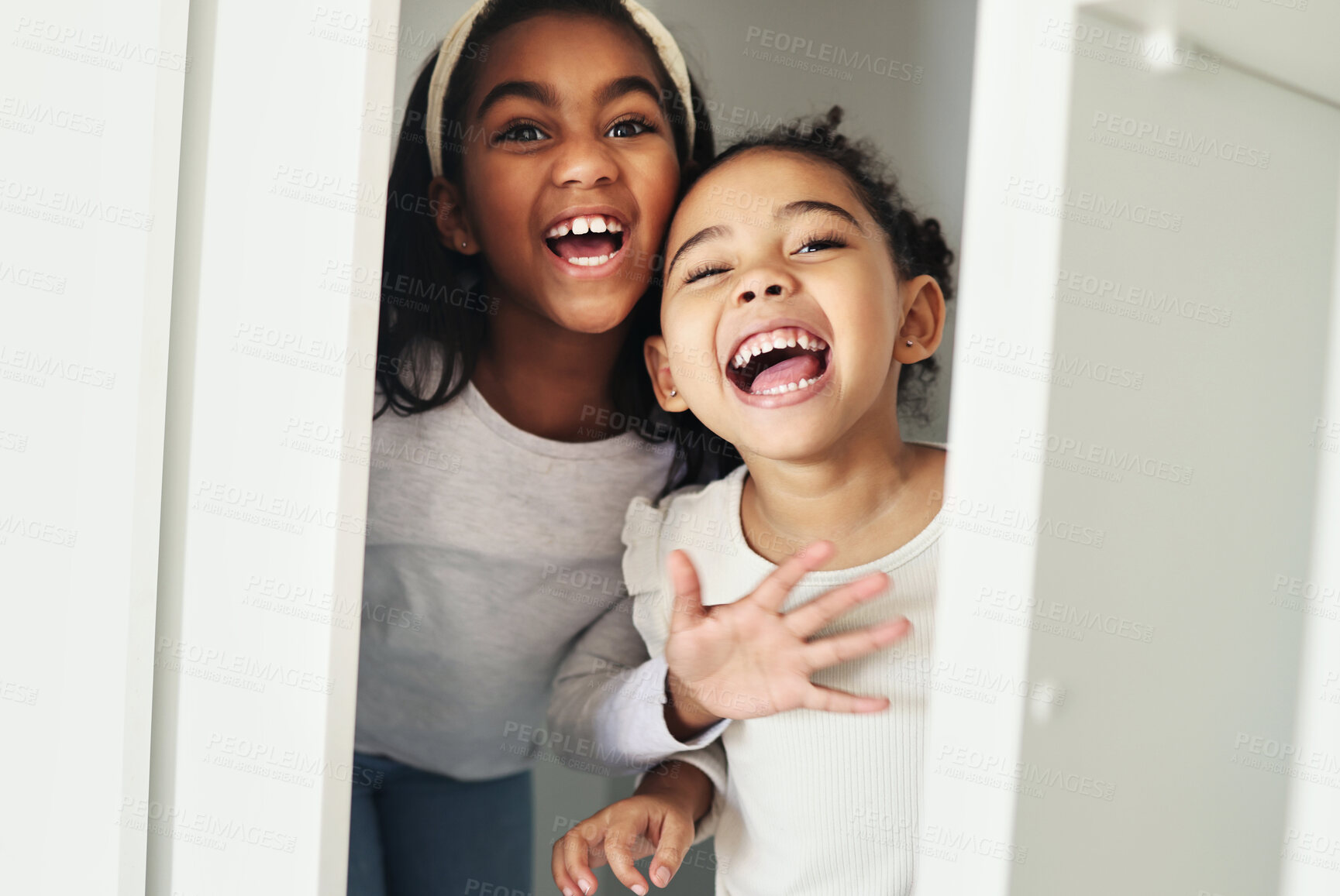 Buy stock photo Girl children, door and surprise game with bonding, smile and playful in family home with sisters. African female kids, happy and holiday with love, comic time and funny joke for scare in bedroom