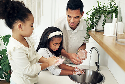 Buy stock photo Dad, kids and washing hands in bathroom with soap at tap teaching girls hygiene on morning routine. Water, soap and man with children cleaning dirt, bacteria and germs for health, care and wellness.