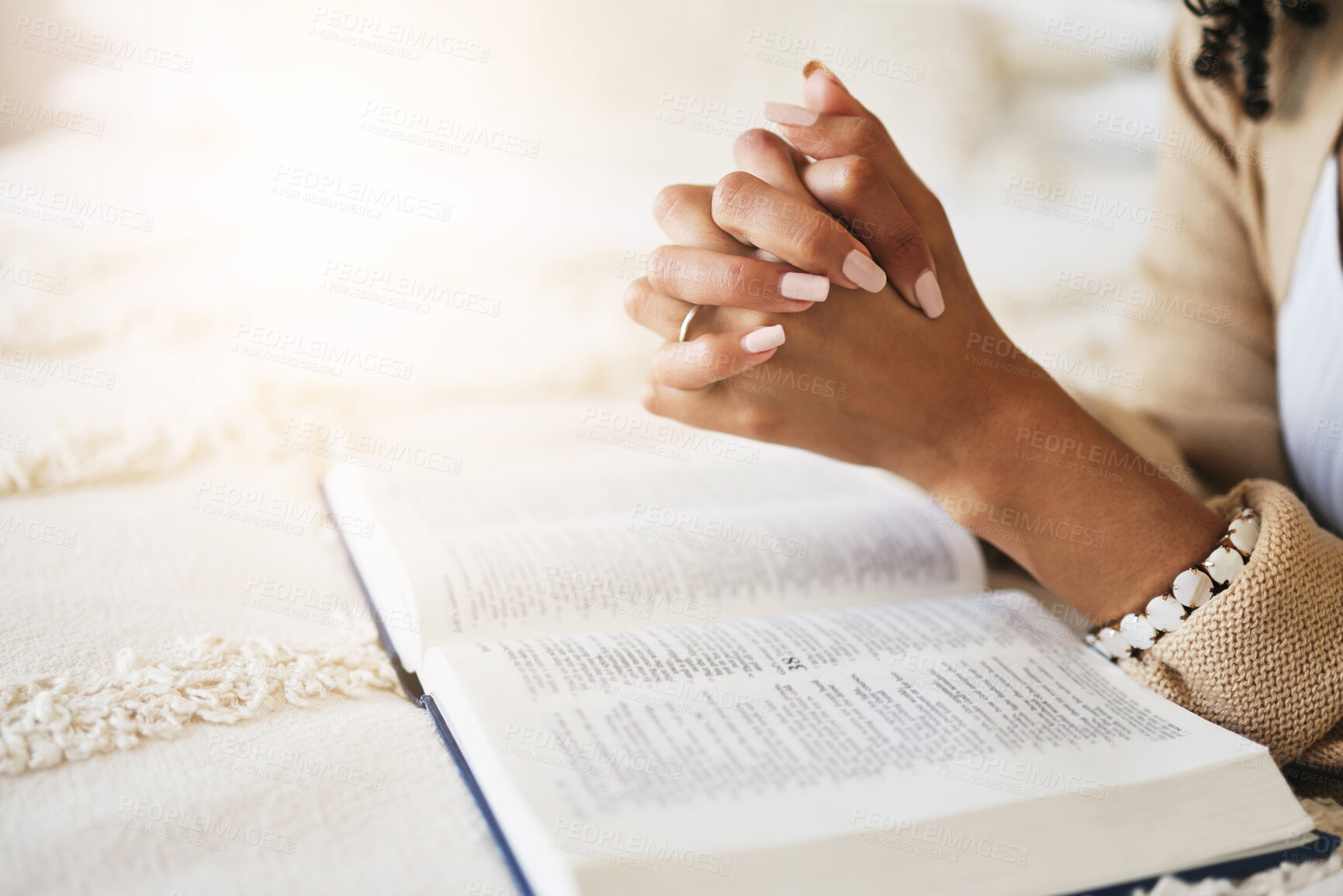 Buy stock photo Prayer, bible and hands praying for religion, hope or help, spiritual or faith in home. God, christian and female or woman worship Jesus Christ or Holy Spirit with catholic text or book for peace.