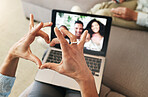 Hand heart, video call and love with laptop, family and communication with emoji, connection and bonding. Hands, person relax at home and happiness with care, connectivity with virtual chat in lounge