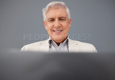 Buy stock photo Senior, computer and professional business man isolated on a gray background for online planning and market research. Corporate person, boss or executive working on laptop tech for asset management 