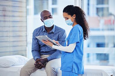 Buy stock photo Doctor consultation, mask and patient results of a nurse with a black man in a hospital. Clinic, covid conversation and nursing communication with medical data and healthcare discussion for advice