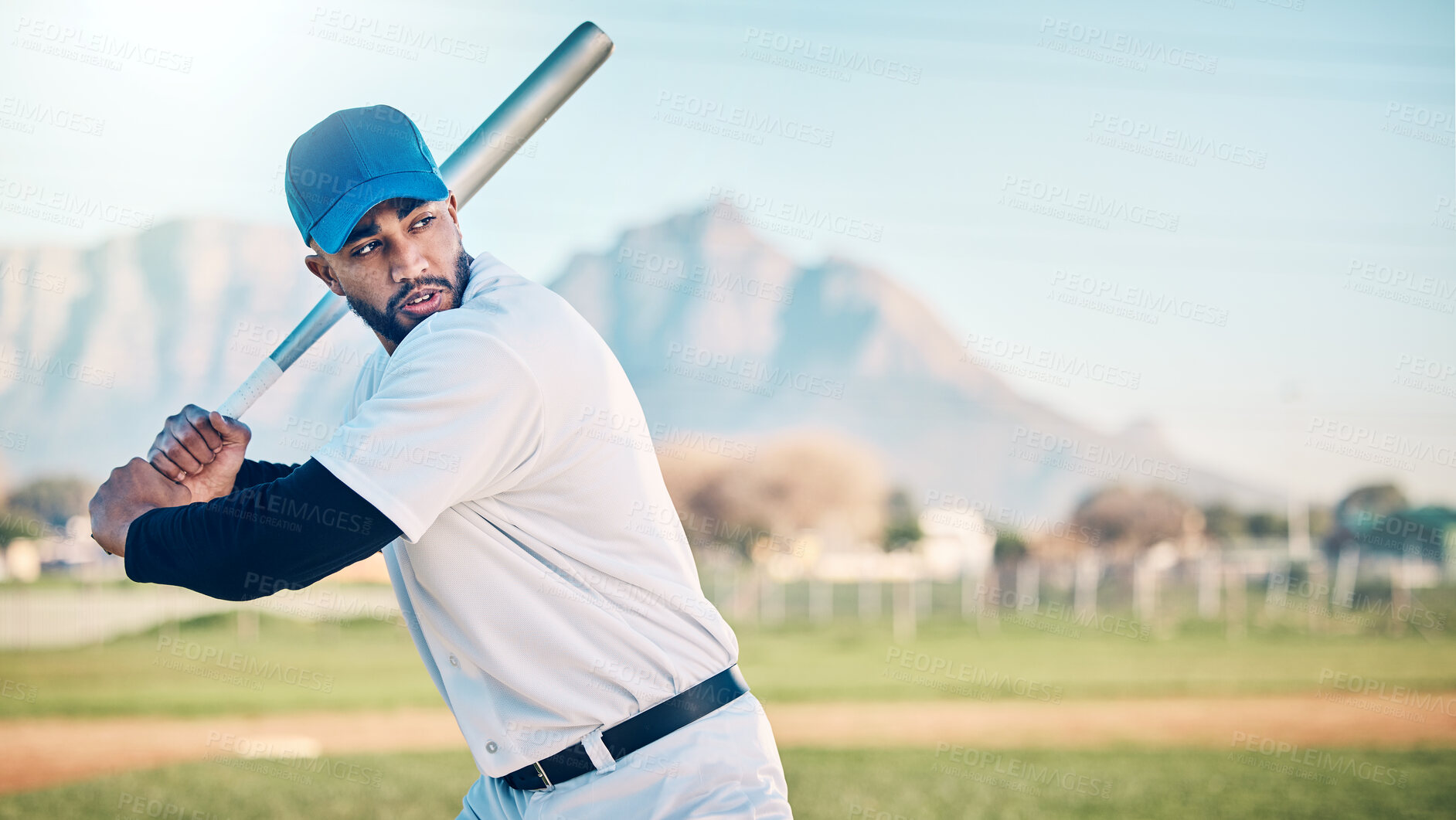 Buy stock photo Baseball swing, athlete and mountains of a professional player from Dominican Republic outdoor. Sport field, bat and sports helmet of a man doing exercise, training and workout for a game with mockup