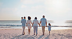 Grandparents, parents and children walking on beach for holiday, vacation and weekend by sea. Travel, sunset and kids holding hands with big family for adventure, journey and relax for bond together