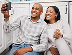 Selfie, black couple and morning in a kitchen happy about new real estate and property purchase. House, smile and happiness of young people together taking a social media profile photo for web app