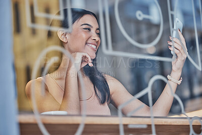Buy stock photo Coffee shop, selfie and window with a woman customer sitting at a table in a restaurant on the weekend. Social media, mobile and relax with an attractive young female taking a photograph in a cafe