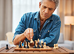 Chess, play and senior man with board game piece while practicing strategy in home alone. Checkmate, chessboard and retired male playing sports and thinking for problem solving challenge in house.