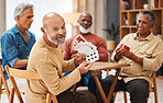 Showing, portrait and senior friends with cards for a game, playing and bonding in a house. Smile, show and elderly group of men in a nursing home for poker, games and competitive for fun together