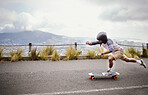 Skateboard, action and man in road for sports competition, training and exercise in urban city. Skating, skateboarding and male skater on board for speed, adventure and freedom for extreme sport