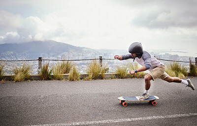 Buy stock photo Skateboard, action and man in road for sports competition, training and exercise in urban city. Skating, skateboarding and male skater on board for speed, adventure and freedom for extreme sport