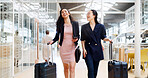 Business woman, phone and walking with luggage in travel for work trip partnership at the workplace. Happy women talking or chatting on a walk to the airport for opportunity or journey with suitcase