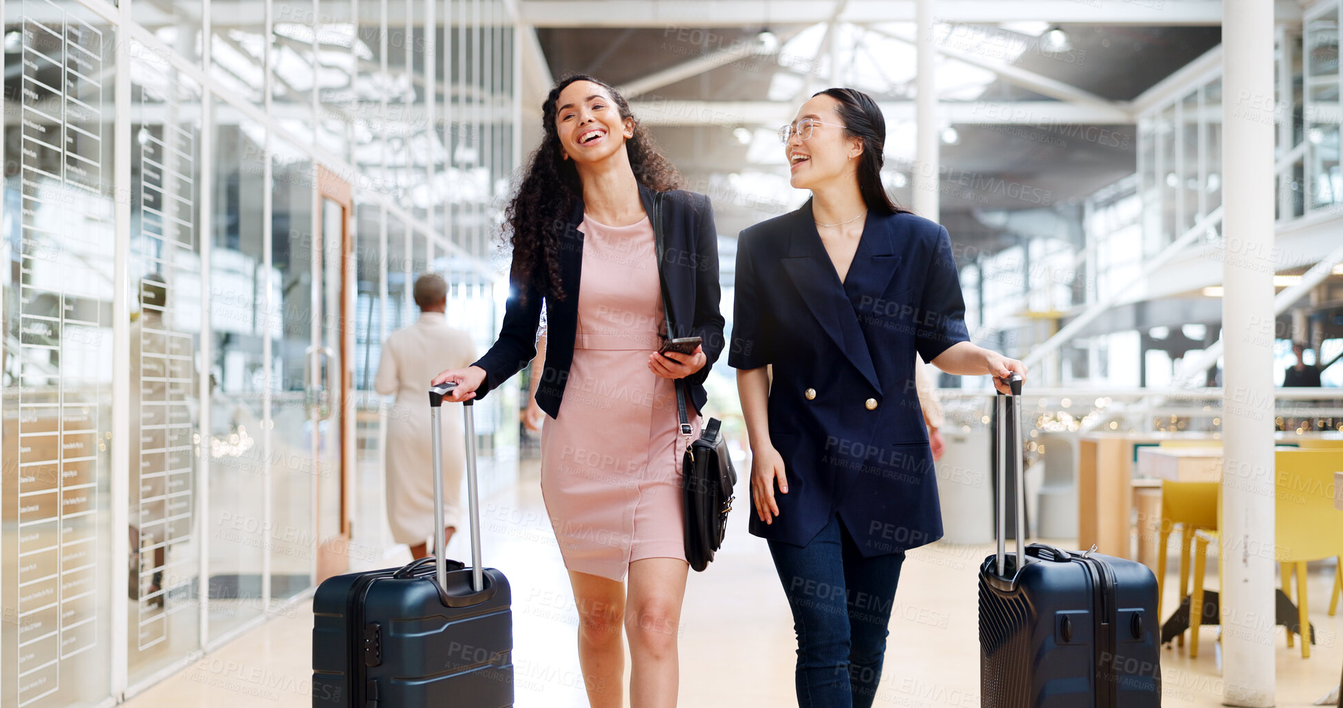 Buy stock photo Business women, phone and walking with luggage in travel for work trip and partnership at an airport. Happy, talking friends or employees together at a lobby for opportunity or journey with suitcase