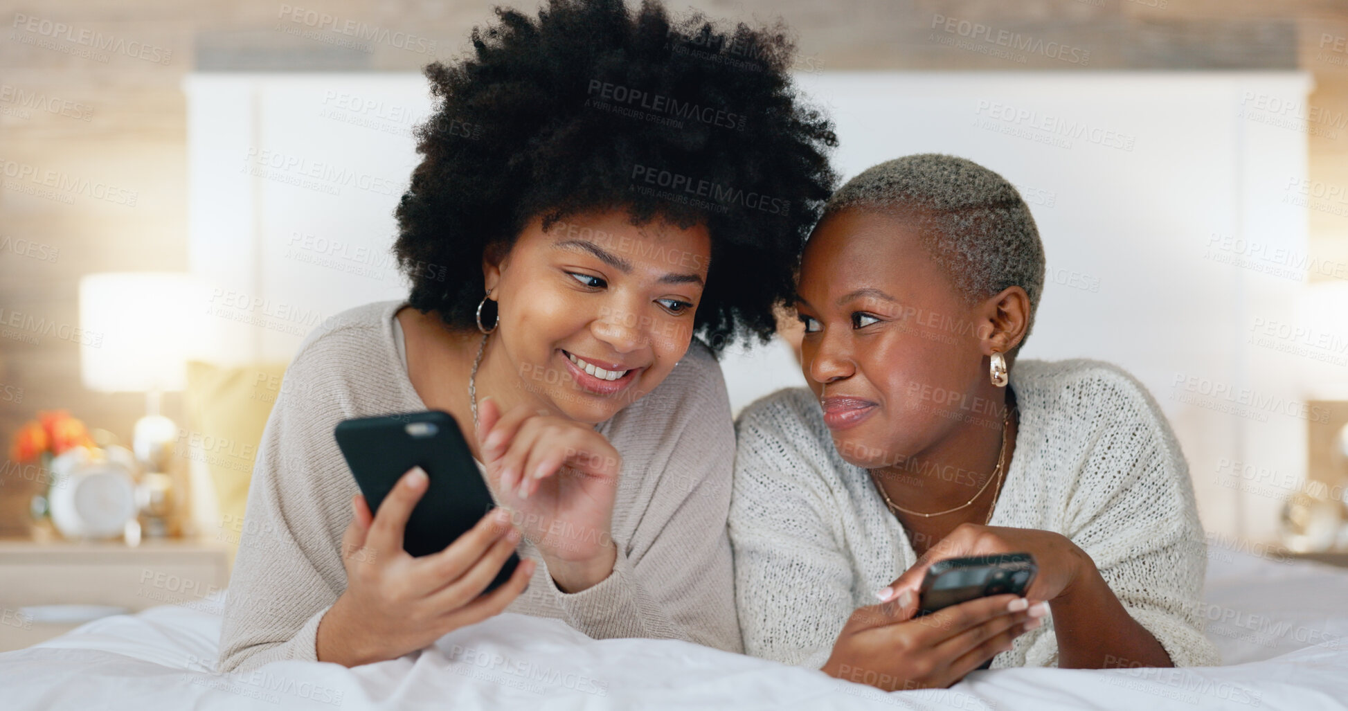 Buy stock photo Phone, bed and face of happy friends reading gossip news, social network article or online communication, email or blog. Cellphone connection, home bedroom and relax people check website information