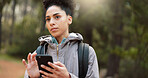 Phone, hiking and female in nature for a gps location, travel and freedom in mountains of Peru during a holiday. Young, thinking and black woman with a mobile for communication while trekking in a forest