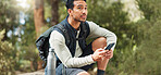 Phone, hiking and man in nature for a gps location, travel and freedom in mountains of Peru during a holiday. Young, thinking and Asian man with a mobile for communication while trekking in a forest