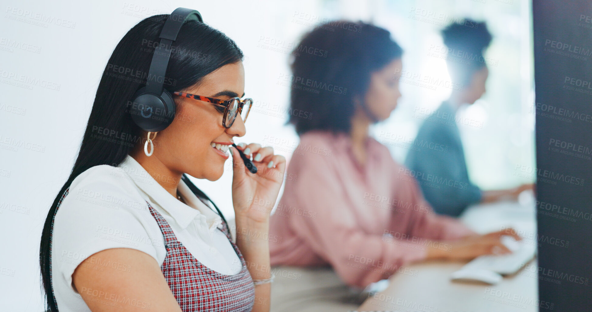 Buy stock photo Telemarketing, woman and office with customer service, call center and contact us work with smile. Talking, crm and phone consulting in agency with working, employee and happy at desk with workers