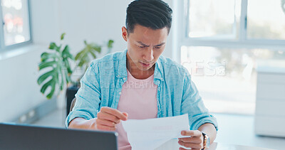 Buy stock photo Asian man, reading and documents in debt, finance or checking bills and expenses at home office. Male person or freelancer with paperwork in financial crisis, over budget or taxes at the house