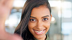 Smiling, beautiful and fresh female face winking feeling fun, silly and playful. Portrait of a happy woman head with perfect skin and healthy teeth. Closeup of a carefree natural beauty with a smile