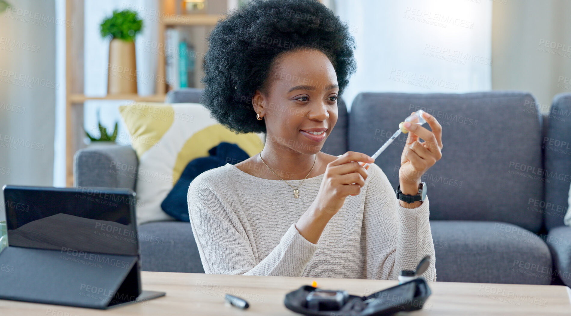 Buy stock photo Woman, syringe and insulin in home, table and preparation for injection, healthcare or tablet for steps on telehealth app. African girl, needle and drugs for diabetes, wellness and pharma product