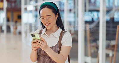 Phone, mall and Asian woman typing, social media or messaging. Technology, coffee and happy female with mobile smartphone for networking, internet browsing or web scrolling alone at shopping mall.