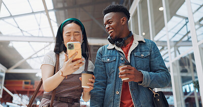Shopping mall, smartphone and couple of friends on social media, website or blog for discount, sales and travel communication. Diversity gen z people walking, using phone or cellphone and coffee cup
