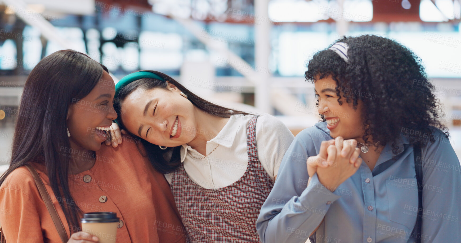 Buy stock photo Coffee, smile and women friends holding hands in a hotel for shopping mall and lunch break together. Diversity, happy or funny with a group of young people laughing in store lobby for bonding