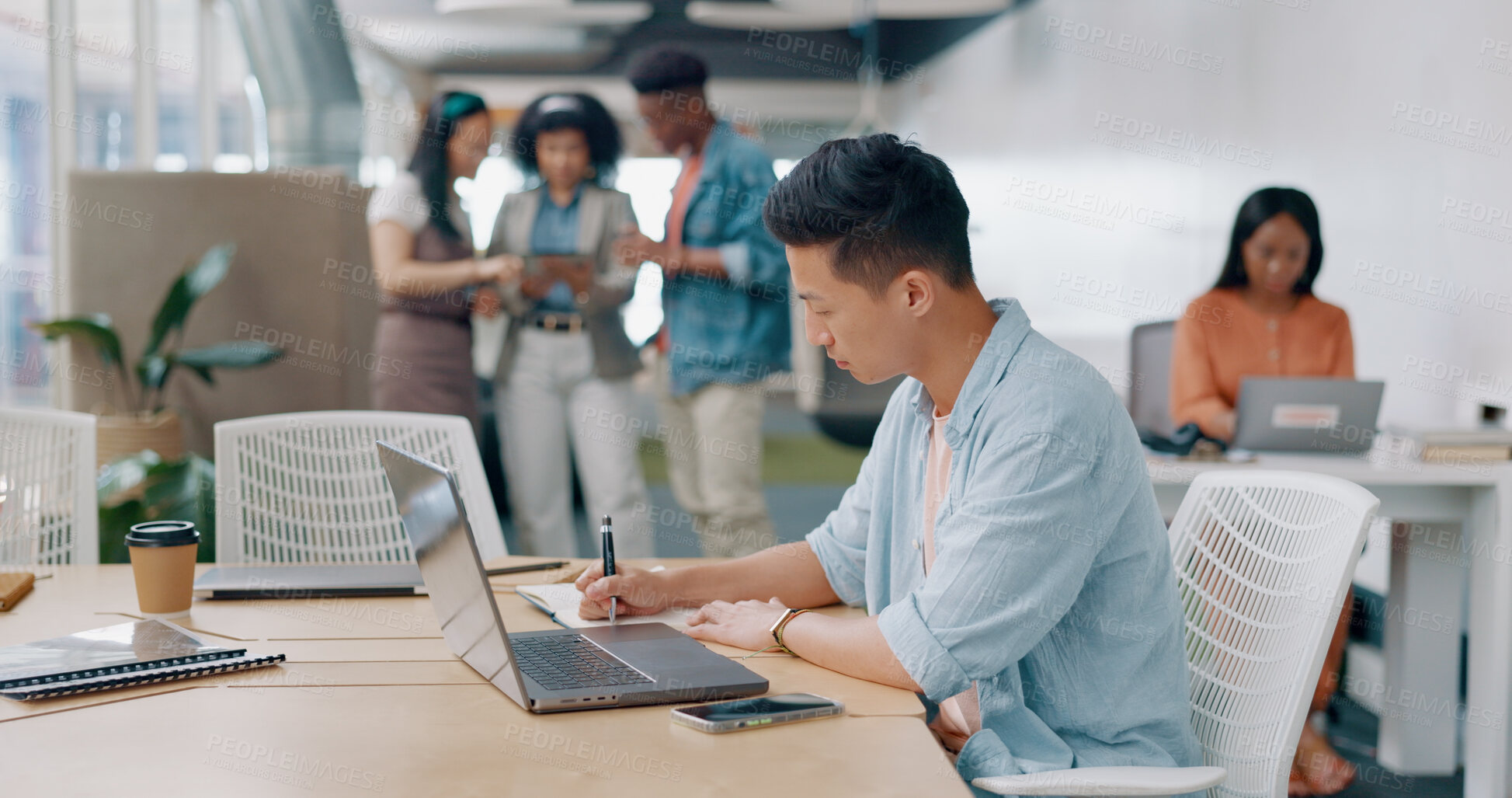 Buy stock photo Asian man in office, writing notes and laptop for market research, email or online report at startup. Creative businessman in coworking space with computer, notebook and business ideas at tech agency