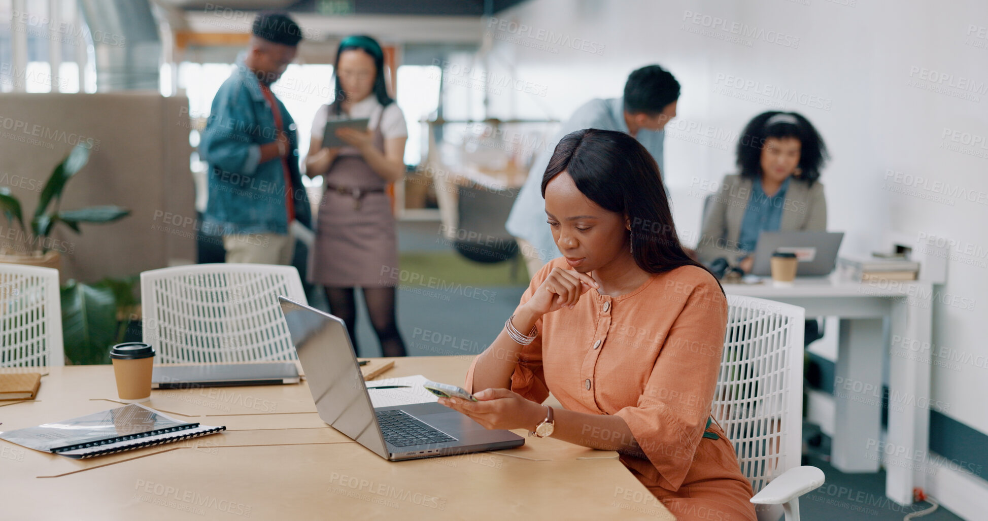 Buy stock photo Thinking, phone and black woman on laptop in office for digital marketing, writing notes and online schedule. Creative agency, advertising and worker on technology for planning, business and ideas