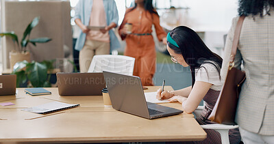 Asian woman, laptop and writing in notebook for planning strategy, schedule management or finance checklist in office. Employee, reading email communication and notes for creative startup company