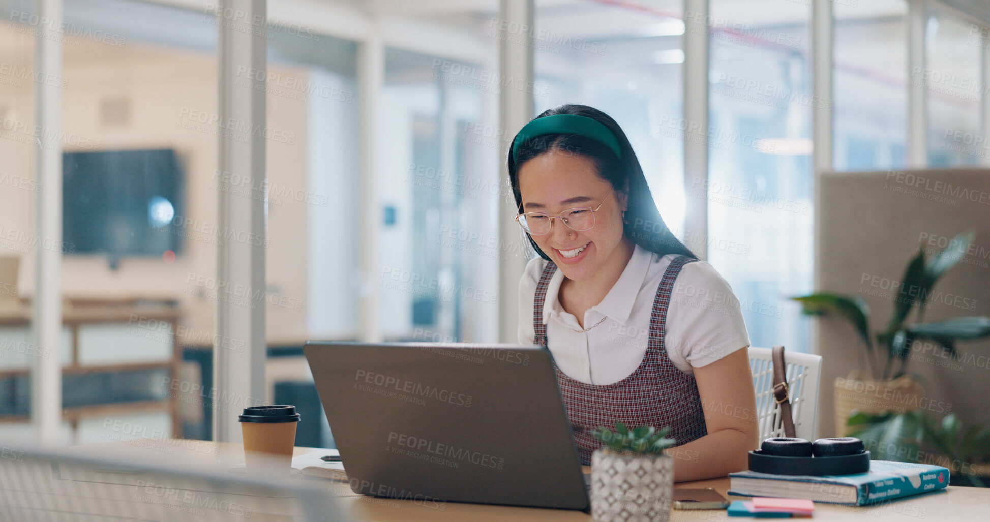 Buy stock photo Asian woman in office, smile and laptop for market research, email or online report at startup. Creative businesswoman reading web at computer at desk, happiness and business feedback at tech agency.