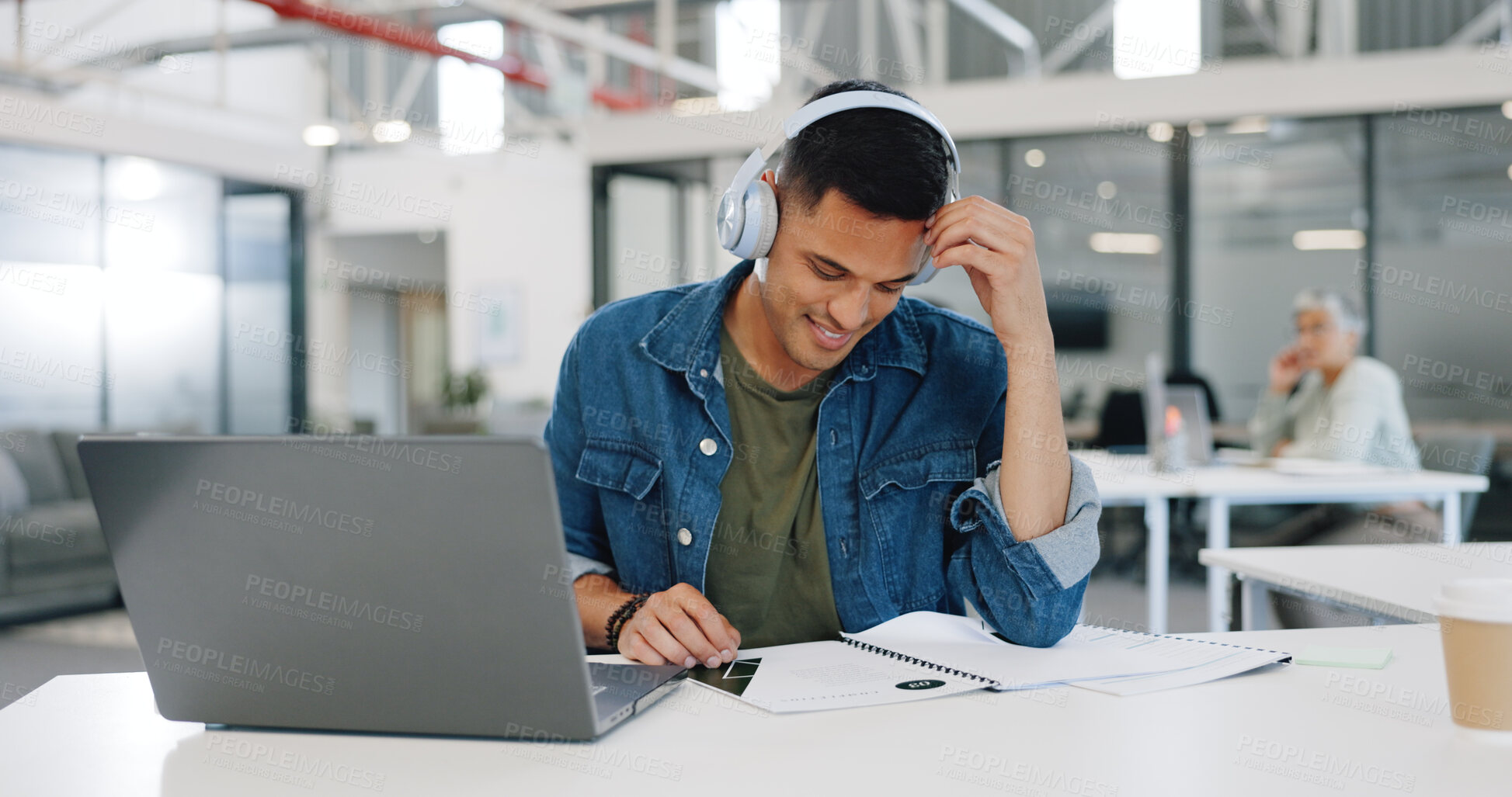 Buy stock photo Happy man, laptop and listening to music on headphones with paperwork, documents or reading at office. Male person or creative employee smile in audio streaming, project or startup at workplace