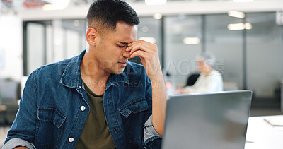 Buy stock photo Creative man, laptop and headache in mistake, stress or burnout from mental health at office. Frustrated male person or tired employee with migraine, anxiety or depression in startup, crisis or debt