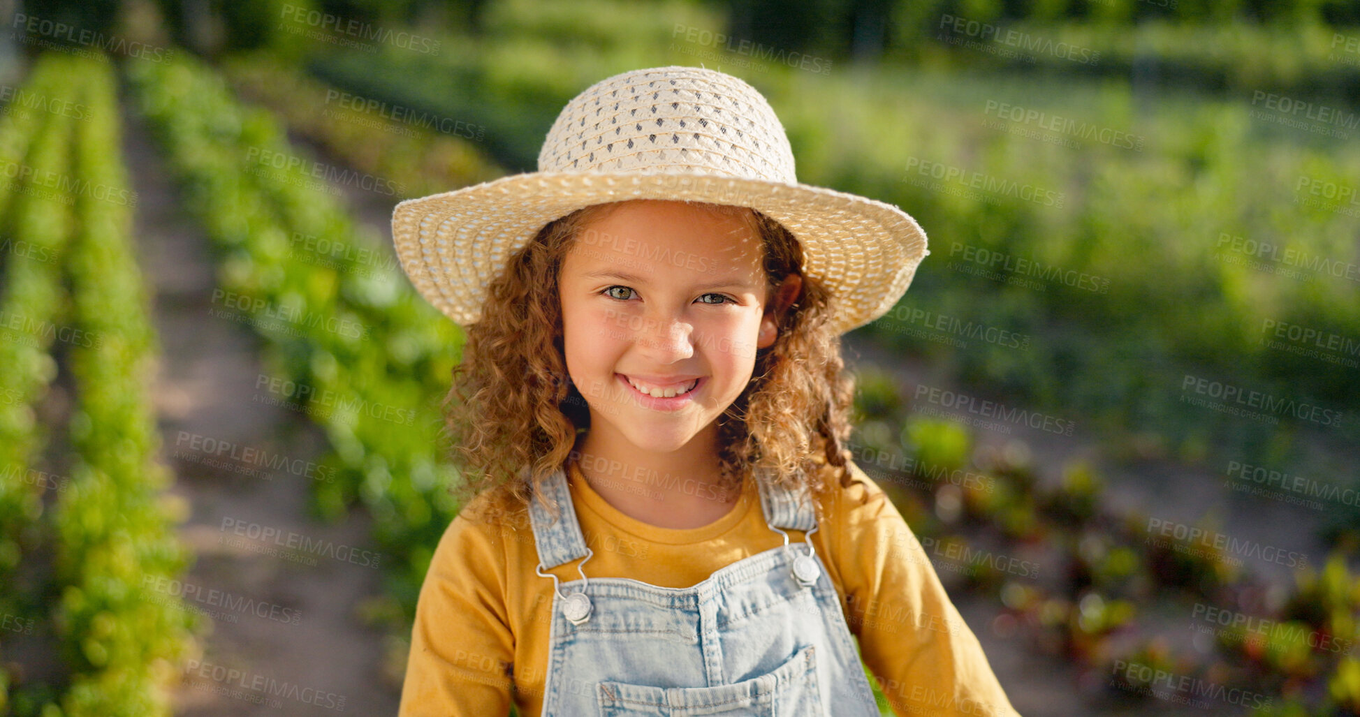 Buy stock photo Portrait, agriculture and girl child with a smile, farm and sustainability with break, sunshine and plants. Face, person and kid with a straw hat, countryside or harvest with vegetables and happiness