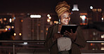 Tablet, night and balcony with a business black woman doing research online while standing outdoor at her office. Working late, search and deadlines with a female employee doing overtime at work