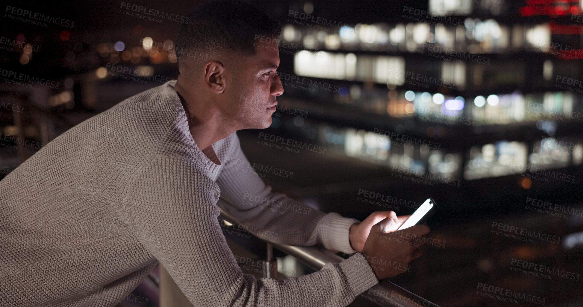 Buy stock photo Smartphone, night and man thinking in city, reading email and rooftop of vision on social media. Phone, balcony and idea of serious business professional, creative problem solving and planning.