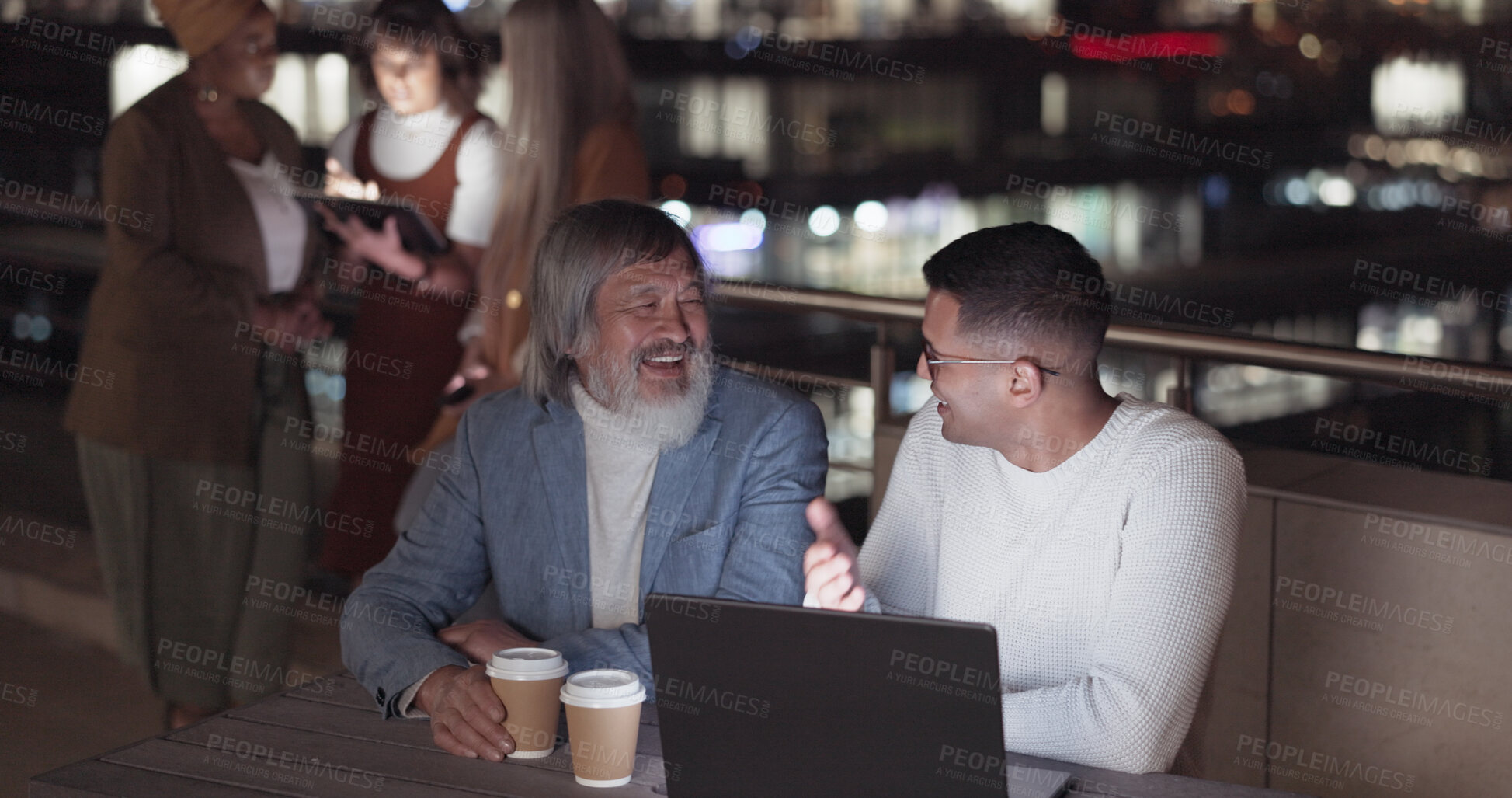 Buy stock photo Night, laptop and business people, manager and laughing at funny conversation, networking humour or joke. CEO, rooftop comedy and team communication, chat and working late on project development