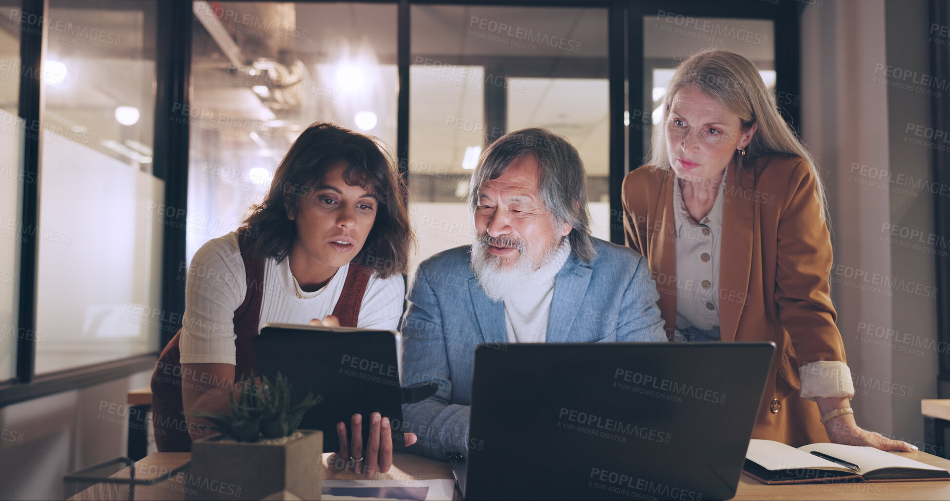 Buy stock photo Laptop, mentor and business people teamwork on night project, digital finance portfolio or feedback review of stock market research. Financial economy, investment collaboration and trading in office